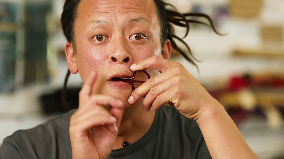 Sanshi playing the jaw harp